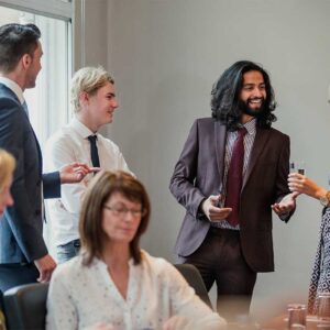 A group of people talking and creating business connections in hertfordshire