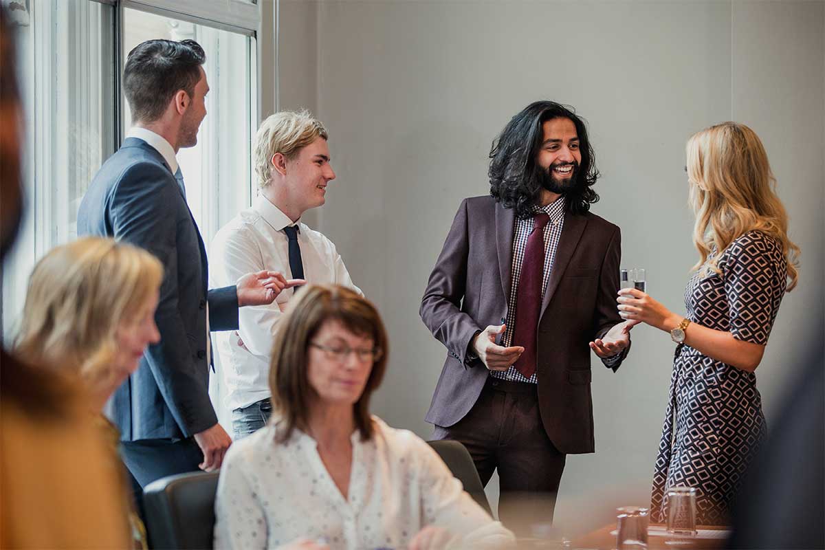 A group of people talking and creating business connections in hertfordshire